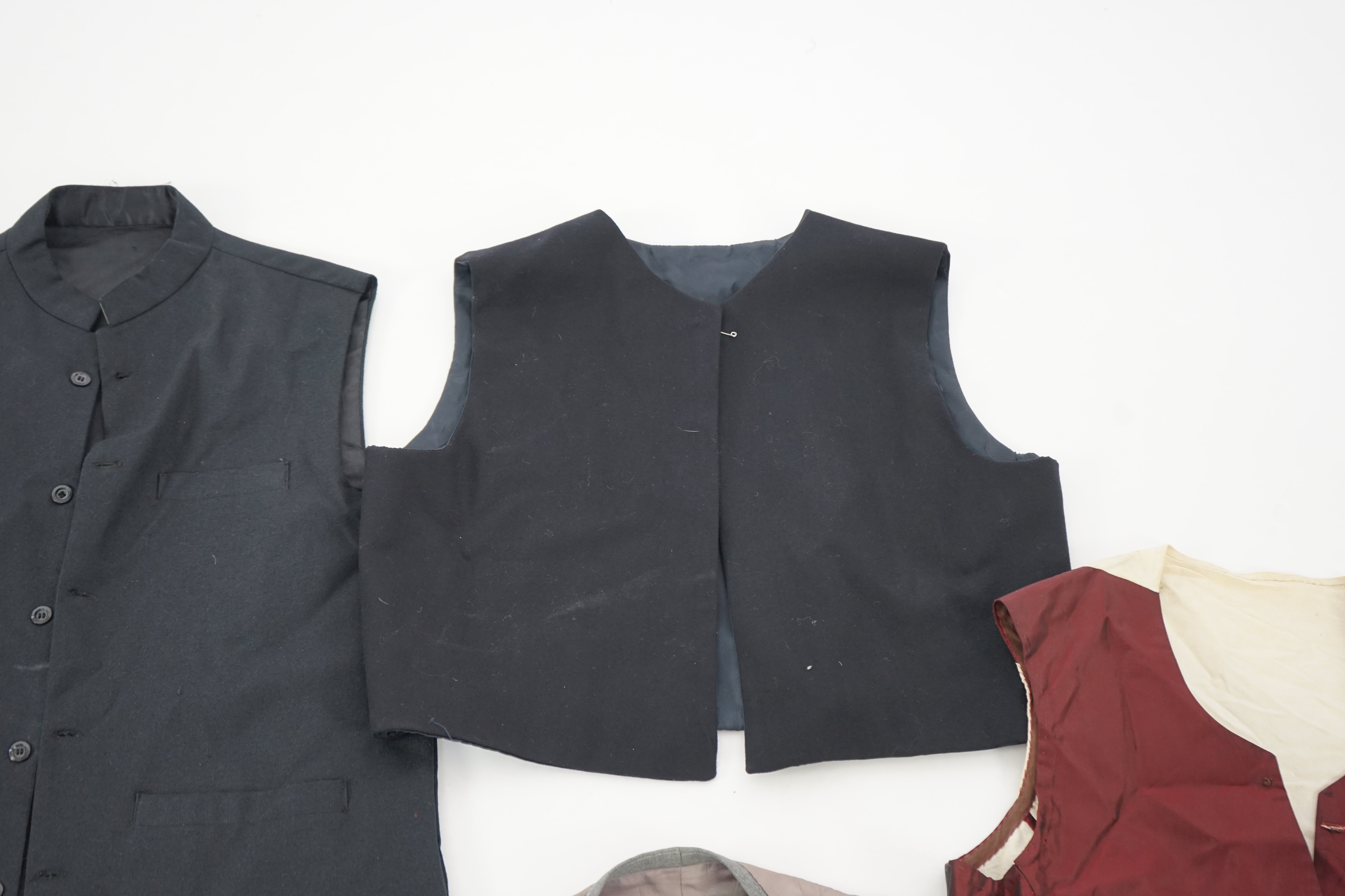 Five assorted men's period waistcoats (darker colours). Ex Pavilion Opera.